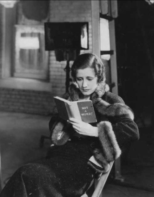 Irene on the set of "Back Street" with her "mad book."