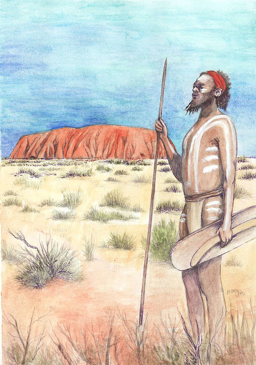 An Aboriginal man with body paint stands holding a spear and shield in front of Uluru in a desert landscape.