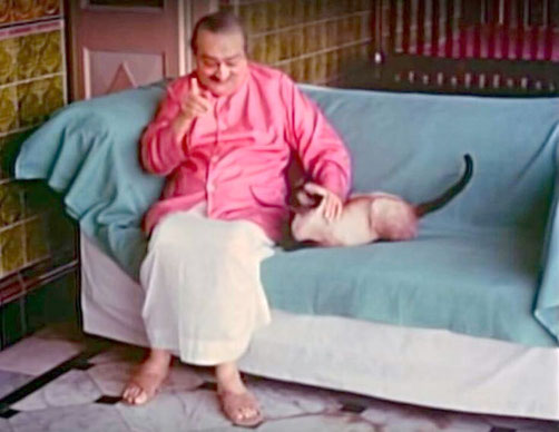 1960s Guruprasad, Pune, India. Baba with the Siamese cat, Pegu.