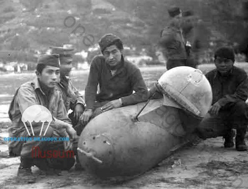 Men of the 442nd in front of a one man submarine torpedo In Nice France riviera 1944.