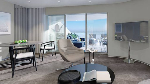 Wohnbereich der Owner Suite der Emerald Kaia mit Sitzgruppe und Zugang zur privaten Terrasse.