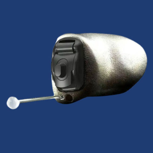 A close-up of a single Phonak Virto Titanium hearing aid with a push button control