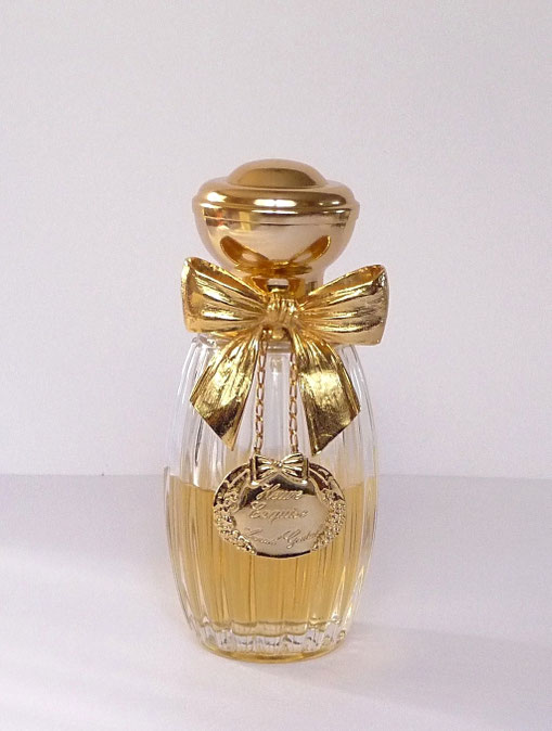 SUPERBE FLACON AVEC GROS NOEUR EN METAL DORE : HEURE EXQUISE EAU DE TOILETTE 100 ML
