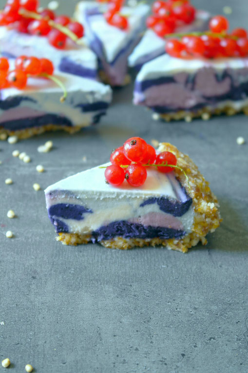 Delicious unicorn cheesecake with blue magic and red currants