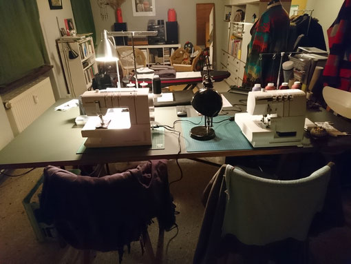 The gray writing and sewing table with sitting area and ironing station in the background. © Griselka 2021