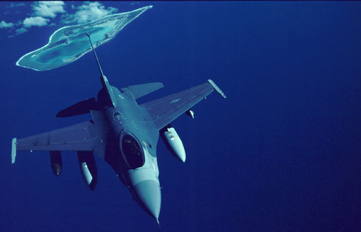 A Korea-bound F-16 passes over mid-Pacific Wake Island.