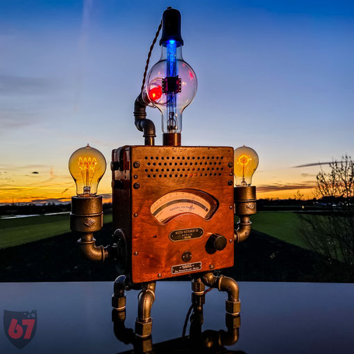 Upcycling lightart artwork with antique found objects and junk - Weston Voltmeter and Westinghouse electron bulb - JayKay67Design by Jürgen Klöck