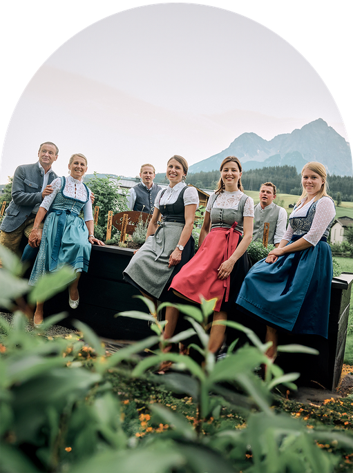 The hosts of the Hochkönigin Wellness Hotel in Maria Alm, Salzburg, in the hotel’s own herb garden