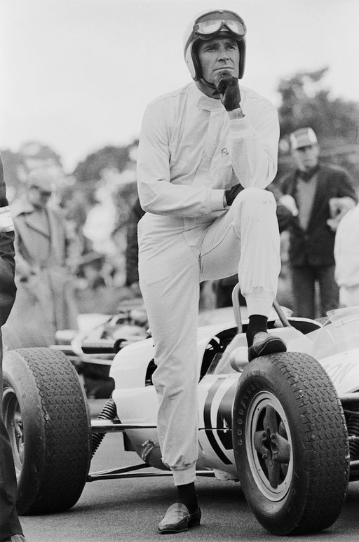 He standing by his car while filming J.Franken Heimer's 1966 racing drama 'Grand Prix' at Brands Hatch.