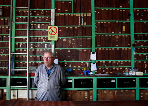 Francisco Santos looks to the door of his ironmonger shop waiting for clients in Sintra May 25, 2011. 