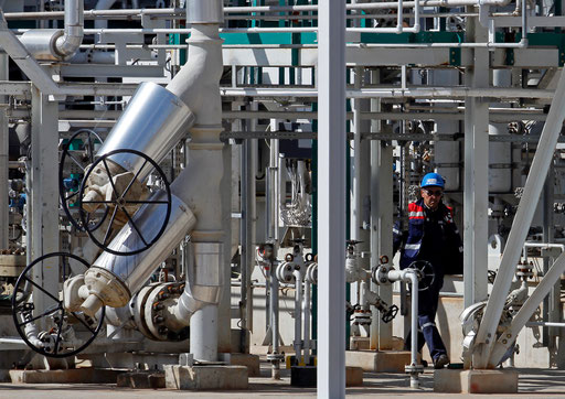 Worker walks on the Portuguese oil company GALP new refinery plant in Sines facilities after its inauguration, 170 Km South of Lisbon, April 5, 2013.
