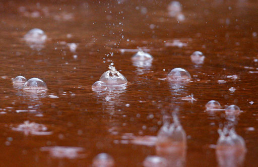 Rain falls on a surface of clay at the Estoril Tennis Open in Lisbon May 9, 2009.
