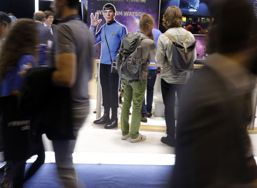 Visitors walk past inside one of the corridors of the 2017 Web Summit in Lisbon on November 7, 2017. 