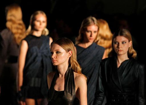 Models present creations by fashion designer Luis Buchinho as part of his Autumn/Winter 2010/11 women's fashion collection during Lisbon Fashion Week March 12, 2010.