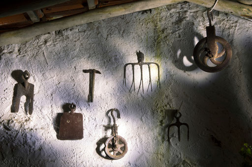 Old rusty farming tools are seen on a wall of a farm in Assafora village, Portugal,  2014.