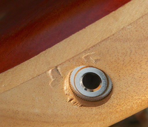 After I had finished the guitar this f...... hole had shrunk so much, that I could not get out the plug and had to destroy it, redrill the hole and stick in a new plug...