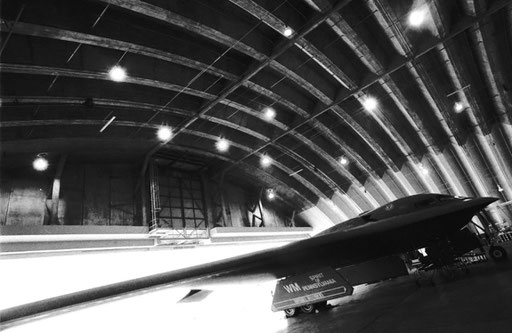 A B-2 Spirit stealth bomber in a hangar at Anderson Air Force Base, Guam. Its otherworldly lines seem like something straight from a science-fiction novel.