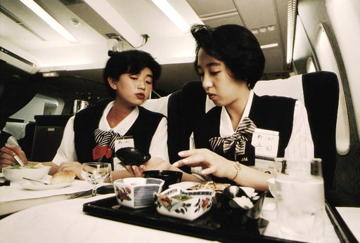 Japan Air Lines cabin crew trainees ponder how to explain a Japanese-style inflight meal in English; Tokyo, Japan.