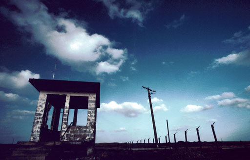 The remains of a guardpost and fencing of the secure area inside the former Air Force facility on Iwo Jima. Nuclear warheads were stored here in the 1960s in preparation for a possible nuclear 'second strike' against the Soviet Union.