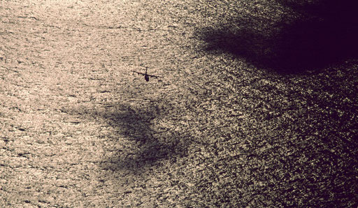 An angel of mercy with an 11-man crew: a Japan Maritime Self-Defense Force US-1 air-sea rescue flying boat swoops low over the sea.