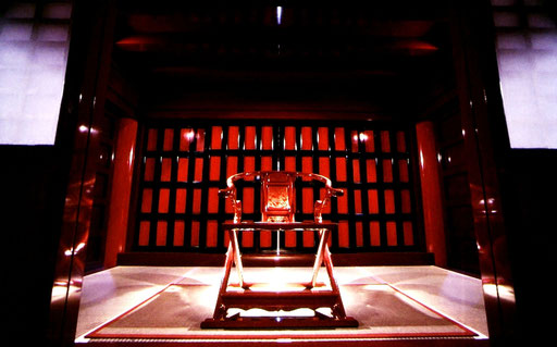 Part of the Usasuka 'throne room' on the upper level of Shuri Castle. If the red-and-black sliding panel doors are opened and the royal chair turned around, the seated king can look directly down on the wide courtyard below.  Shuri Castle, Okinawa, Japan.