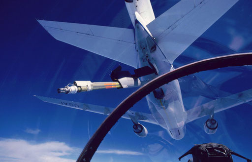 Approaching a KC-10 tanker to refuel, as seen from an F-15 cockpit.  The refueling boom receptacle is just aft of the port wing root leading edge, hence the F-15 is slightly offset to the right of the KC-10's centerline.