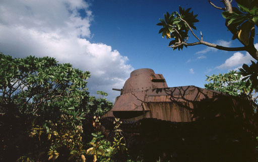 Japanese tankette rusting in the bushes, Marcus Island, Japan.  While the island was attacked from the air, it was never assaulted directly; this tank never fired a shot in anger.