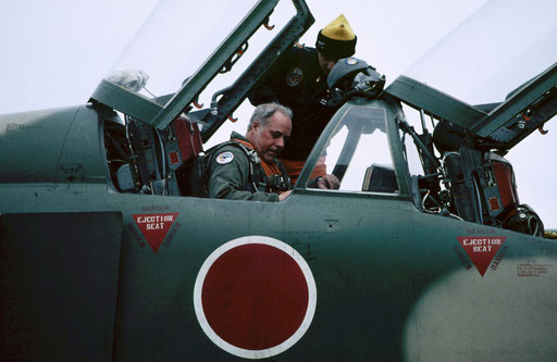 Strapping in before a flight in a Japan Air Self-Defense Force fighter; Misawa Air Base, Aomori, Japan.
