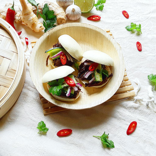 Asian pulled beef in a steamed bun.