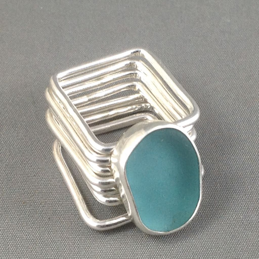 Seven square bands attached to one gorgeous chunk of authentic turquoise sea glass. The ultimate fidget ring! 