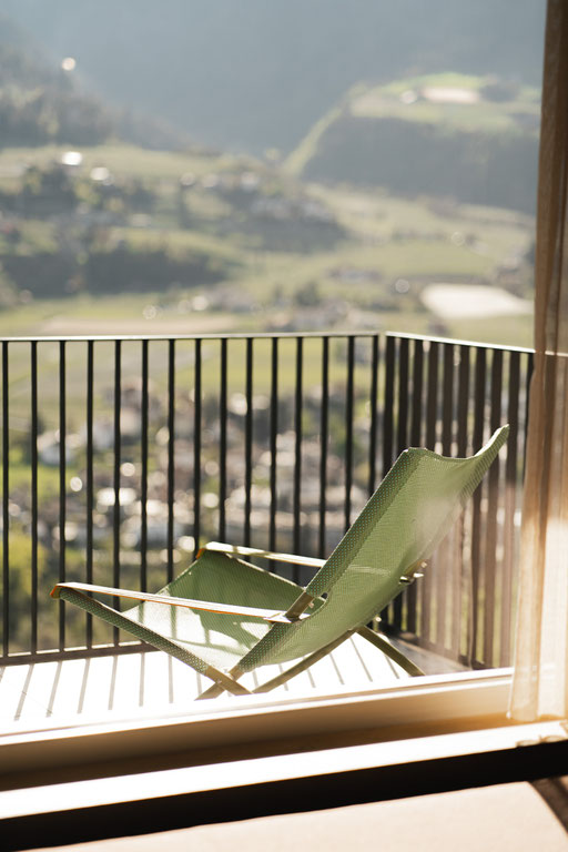 Sun lounger on a private balcony at VINEA Suites & Apartments