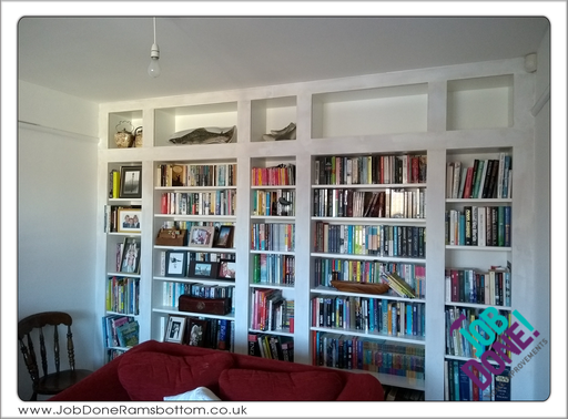 Bookcase; built and adapted five Ikea Billy bookcases to fill the wall space.