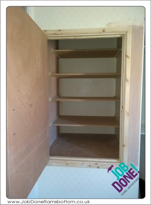Storage cupboard; adapted and hung a new door and installed sliding shelves in the cupboard. 
