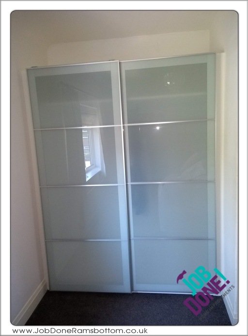 Wardrobe; built and adapted Ikea Pax wardrobes to fit in a bedroom alcove.