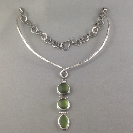 This necklace is half choker and half hand-forged chain which provides a very comfortable fit. The deep green sea glass is perfectly matched and has an enviable glow. 