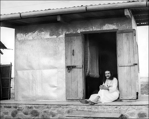 Baba sitting on the cabin threshold in 1937 or '38-Photo courtesy of the Trust Archives