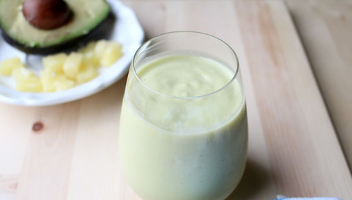 Super creamy avocado smoothie with tropical flavors from pinapple and orange! - www.homemadenutrition.com