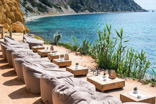 Beach Club Ibiza, small tables and chairs with ocean view