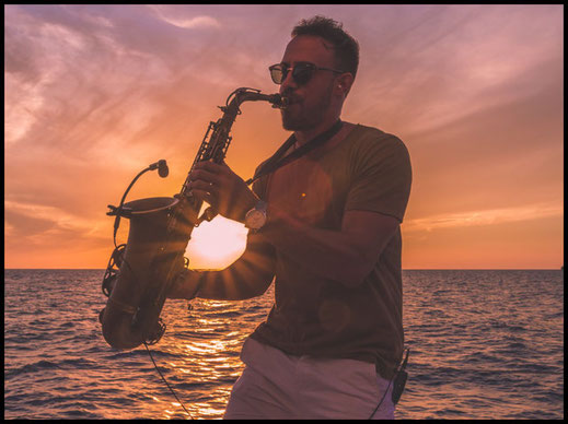 Saxophone player infront of sunset