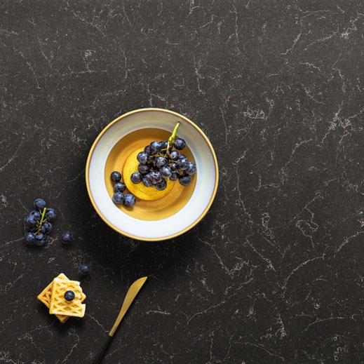 plate on a dark quartz countertop