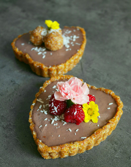 Mini heart shaped tarts filled with chocolate 