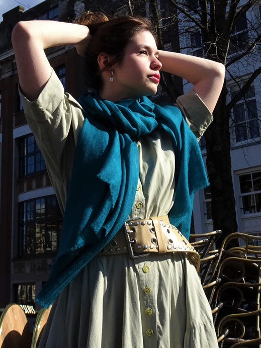 Woman styled a petrol Cashmere shawl.