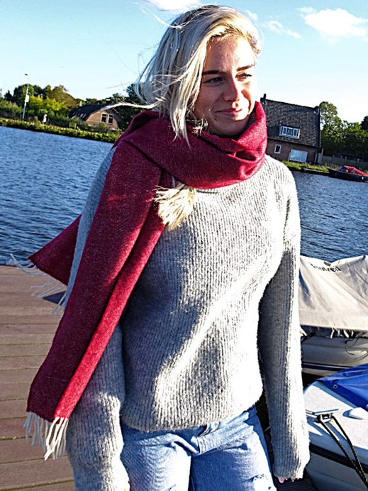 Merino wool scarf 180 × 33 cm styled on female outfit.