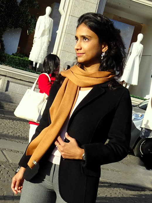 Merino wool scarf worn with black jacket – lightweight and warm for everyday wear