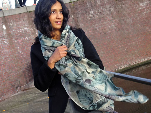 Elegant texture of fine wool printed in natural tones and motifs, woman styled.