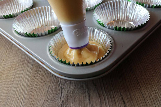 filling cupcakes