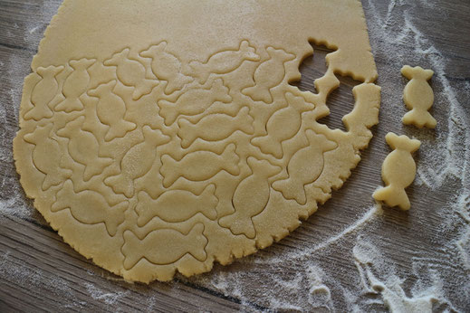 cutting out candy shaped cookies