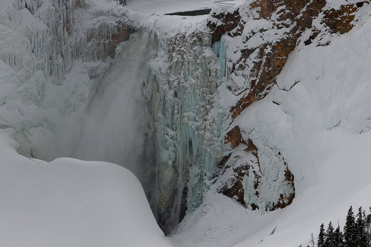 Frozen waterfall Yellowstone, snowmobiling in the park
