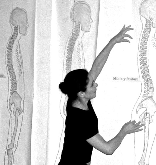 Pilates Certified Comprehensive Rehabilitation Instructor showing workshop students the patterns of various posture types.