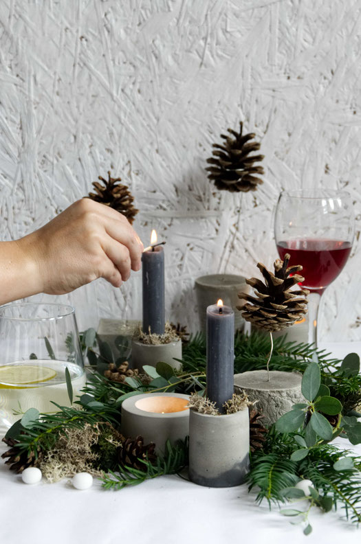 The DIY floating pines featuring in a Christmas centrepiece featuring evergreens and concrete accents by PASiNGA